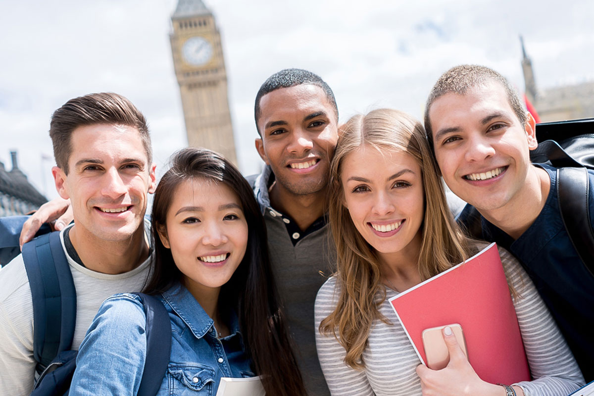 study abroad students standing in a group smiling