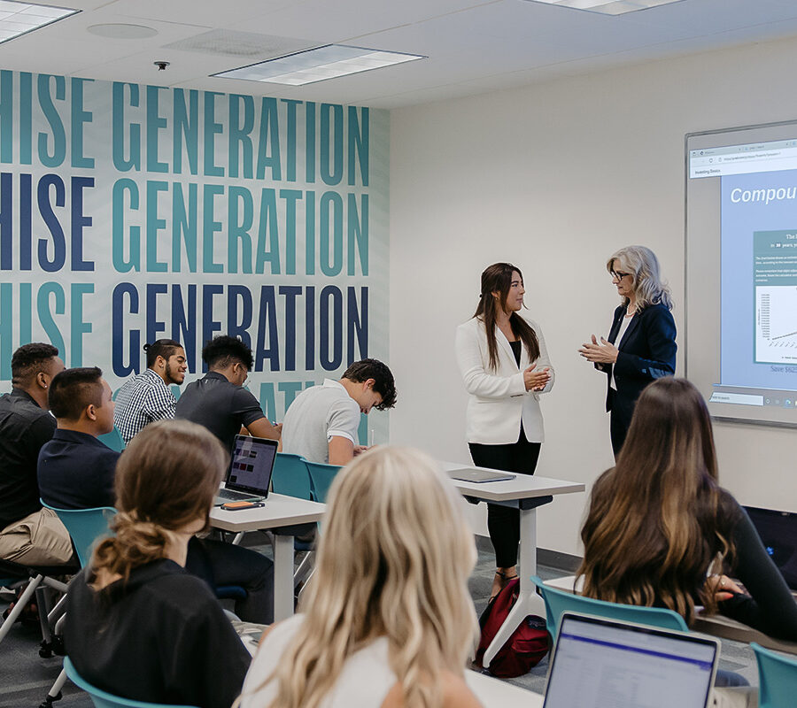 students participating in a classroom lecture with a power point presentation