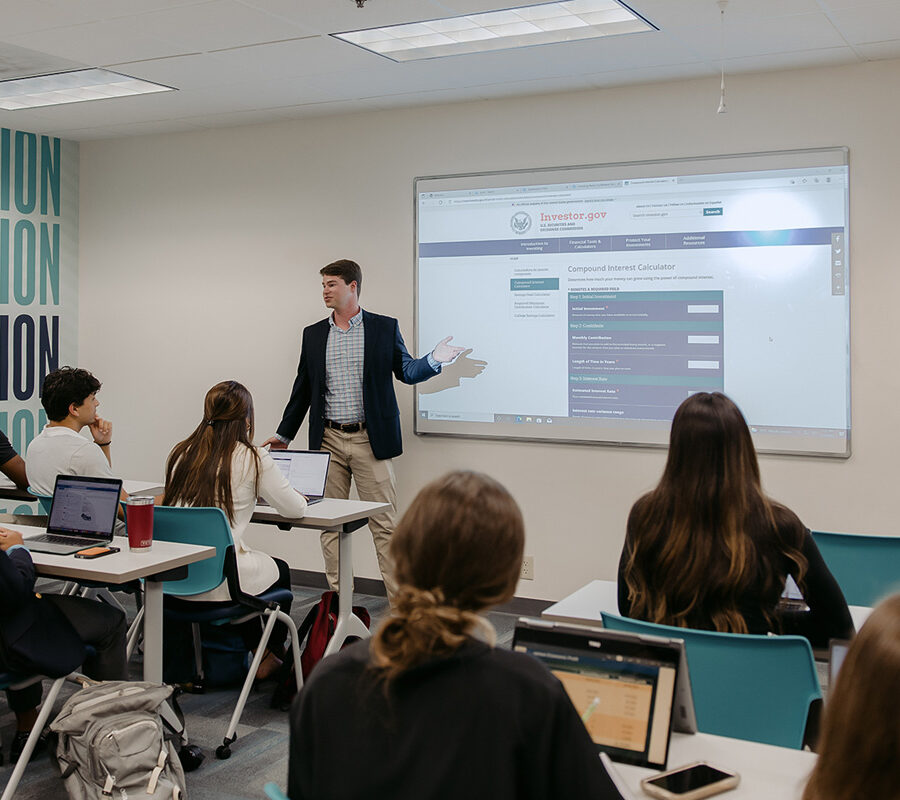 Students listen to an organizational leadership lecture.