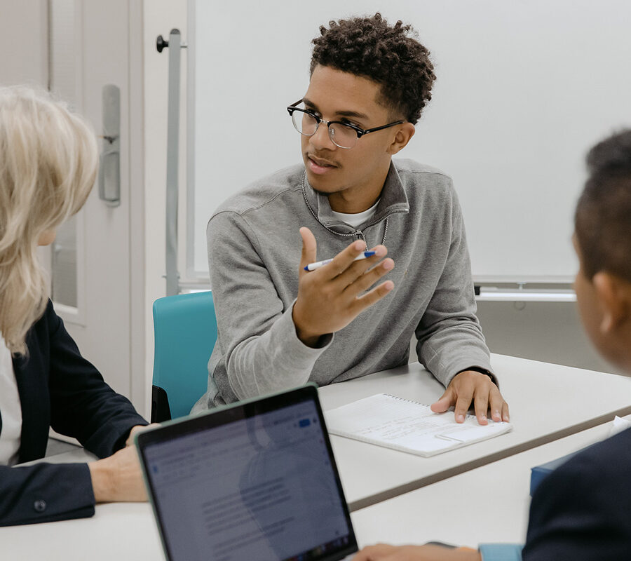 Students from the business data analytics program engage in a classroom discussion.