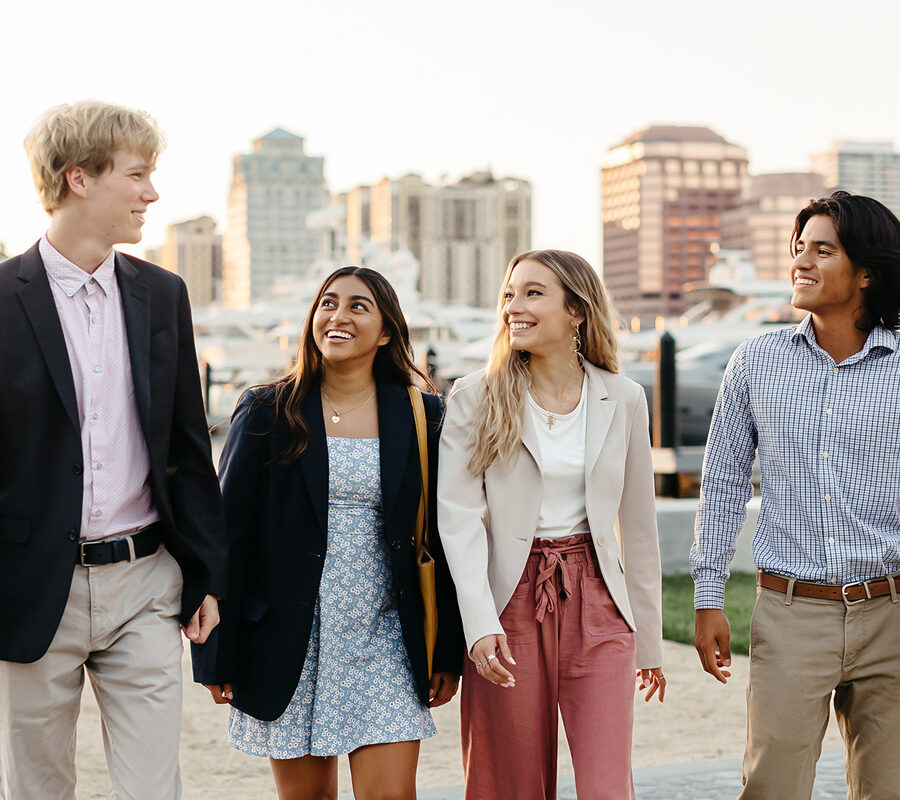 Students from the business administration BSBA program walk along the intercoastal in West Palm Beach.